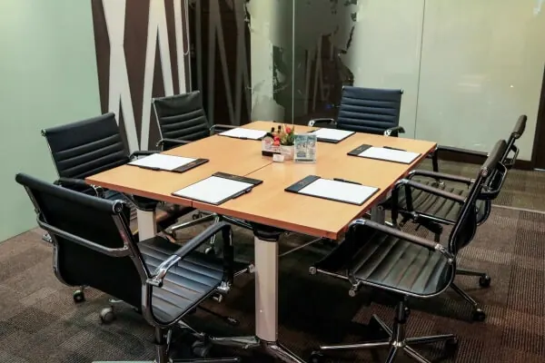 Glass-walled meeting room for eight
