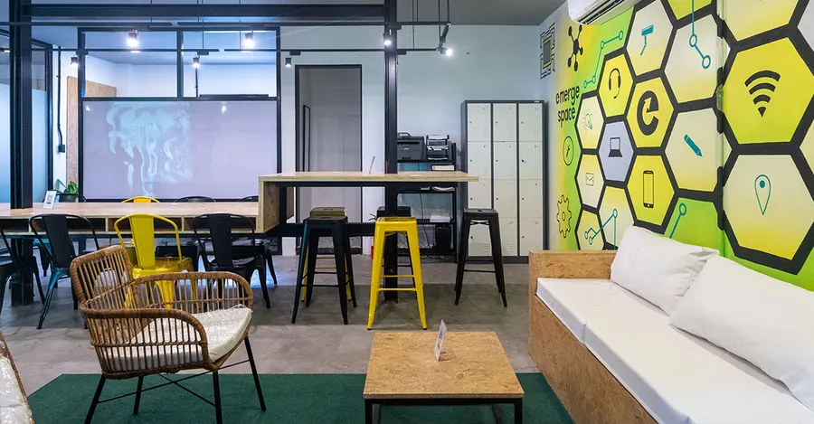 Lounge with a yellow honeycomb mural