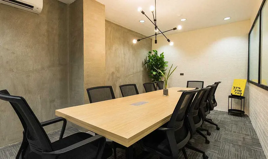 Meeting room with a long wooden table