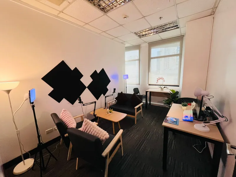 vOffice podcast studio with armchairs, boom microphones, LED lights and acoustic wall panels